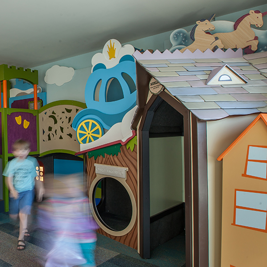 children playing in a carriage nook reading area